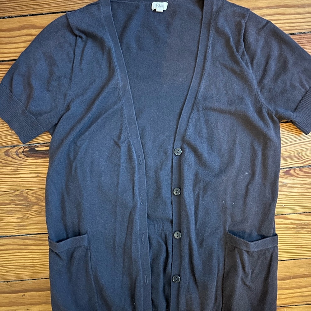 Short sleeve longer cardigan sweater, gray, in the front.